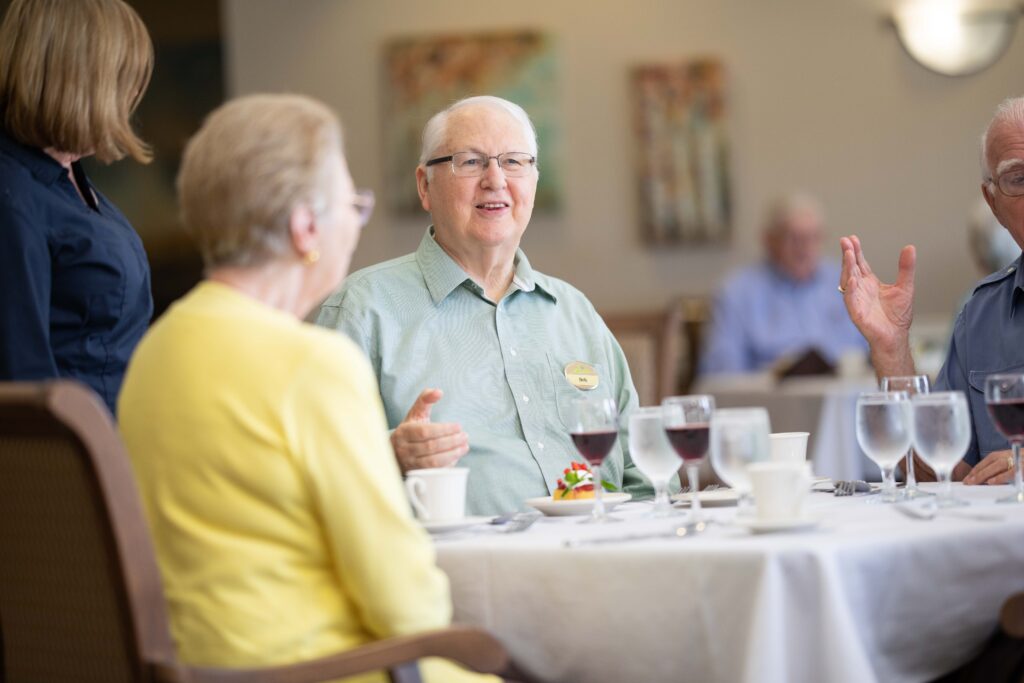 Seniors having dinner together at Hearthwood Senior Living by Schaumburg, IL